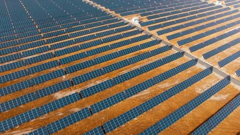 Large solar panel array generates renewable energy in desert Stock Footage 332276362