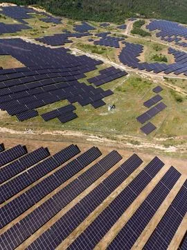 Large solar panel farm generates renewable energy in sunny location Stock Photos