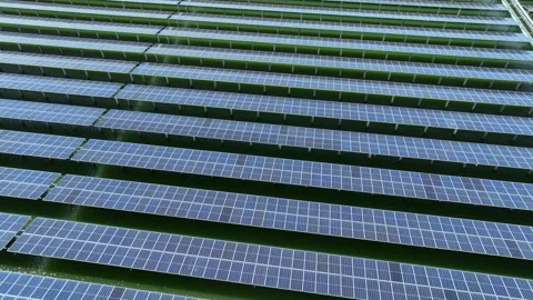 A large solar panel farm with organized photovoltaic arrays. Stock-Footage 343618359