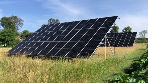Large Solar Panels Installed in a Rural Vegetable Garden Stock Footage 341555904