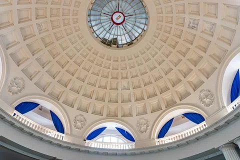 Large, spacious room with a domed ceiling, skylight, arched windows, and a .. Stock Photos
