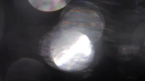 Large sparkling silver bokeh of seven colors in black Видео 318914742