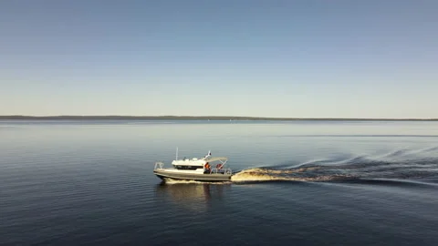 A large speed boat is moving at high speed Stockbeeldmateriaal 155299336
