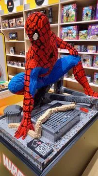 Large Spider-Man statue made of colorful plastic building blocks. Stock Photos