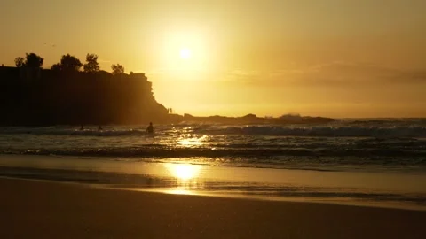 Large splash against rocks at sunrise in Coogee Sydney 6K Video stock 306643127