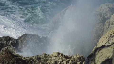 Large splash from wave hitting coast during rough seas Stock Footage 168773658