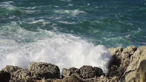 Large splash from wave hitting Mediterranean coast Stock Footage 168801754