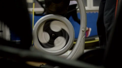 Large Spoked Wheel Spinning Fast, Blue Studio Background, Close Up Shot Vídeo Stock 341445801