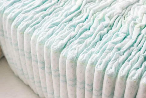 A large stack of baby diapers, close-ups, diaper packaging Stock Photos