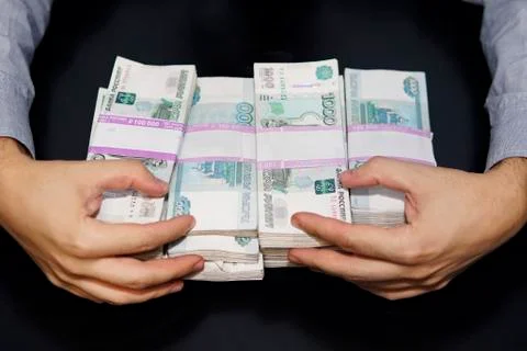 Large stack of banknotes, Russian rubles, banknotes 1000 rubles. hands are gr 스톡 사진