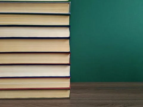 A large stack of books on the table Stock Photos