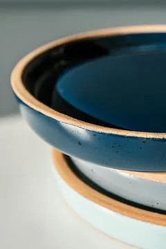 A large stack of ceramic cups in pastel colors. Stock Photos