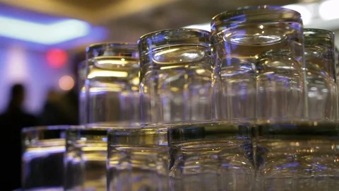 Large stack of cocktail glasses on bar close Stock Footage 112140430