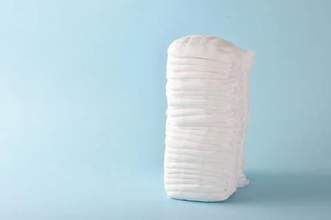 A large stack of disposable children's panties on a light blue background. Foto stock