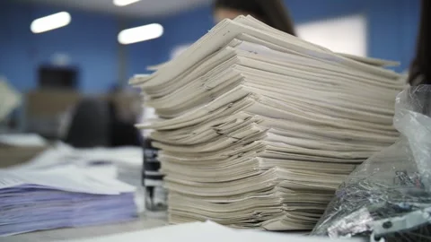 Large stack of documents on desk Stock Footage 301409240