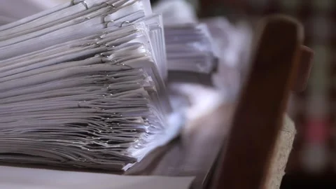  large stack of documents fastened with paper clips in an archive or file cabine Stock Footage 229721083