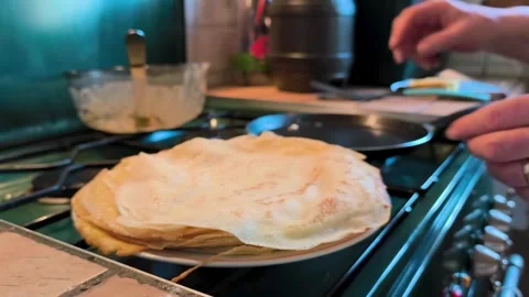 Large Stack Of Freshly Made French Crepes On Plate In Kitchen (2) Stock Footage 323464124