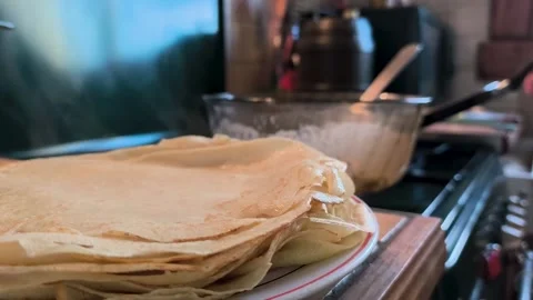 Large Stack Of Freshly Made French Crepes On Plate In Kitchen (1) Stock Footage 323464125