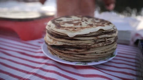 Large stack of freshly made pancakes on the table Stock Footage 229580150