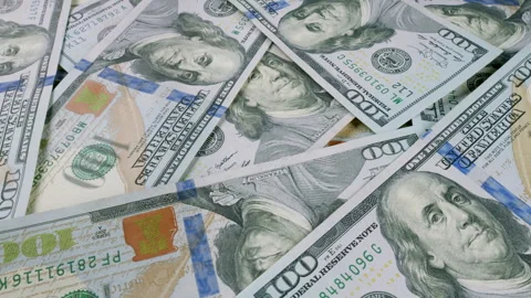 A large stack of hundred dollar bills, representing wealth and significant finan Stock Footage 303627399