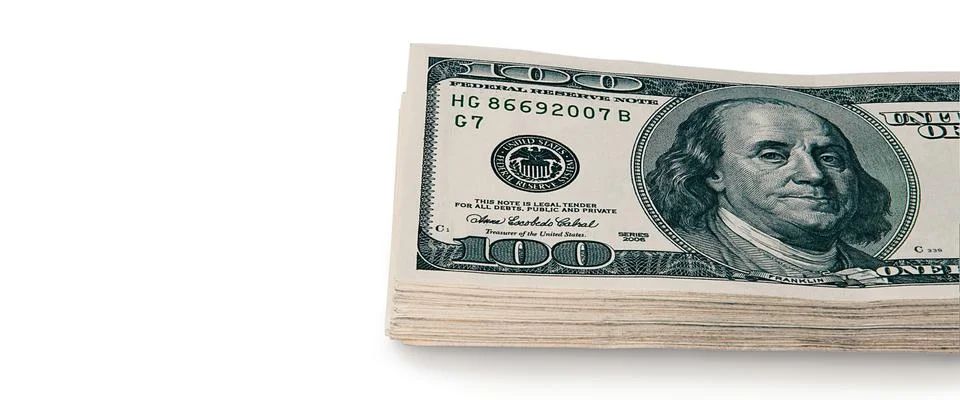 A large stack of hundred-dollar cash bills on a white background. Isolated. Stock Photos