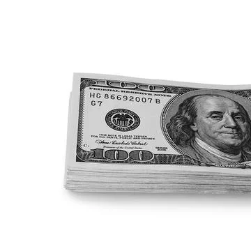 A large stack of hundred-dollar cash bills on a white background. Isolated. Stock Photos