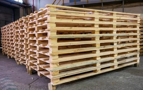 Large stack of new wooden shipping pallets Stock Photos