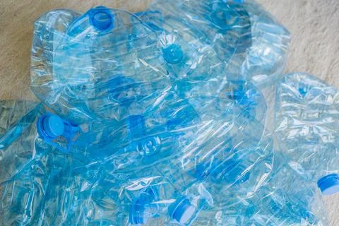 Large stack of old plastic bottles on the floor Stock Photos