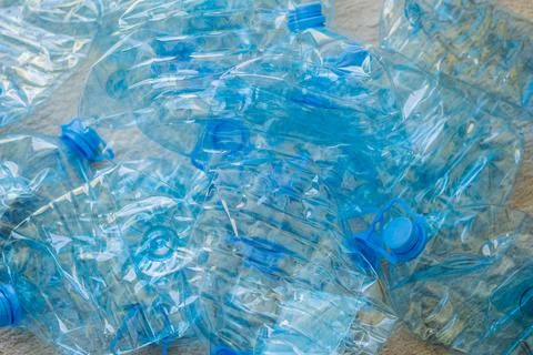 Large stack of old plastic bottles on the floor Stock Photos