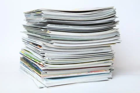 A large stack of printing magazines on a white background. Lots of different  Stock Photos