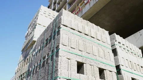 Large stack of pumice blocks and blocks packed on pallets in form of cube. Stock Footage 238813743
