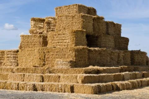 Large stack of square hay bales Stock Photos