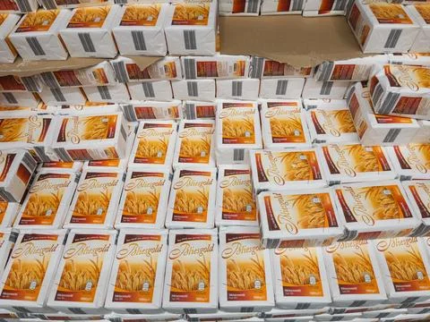 Large Stack of SunGold Wheat Flour Packaging for Retail Distribution Stock Photos