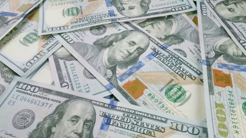 A large stack of U.S. 100 Dollar Bills showcasing abundance and vast financial a Stock Footage 303626690