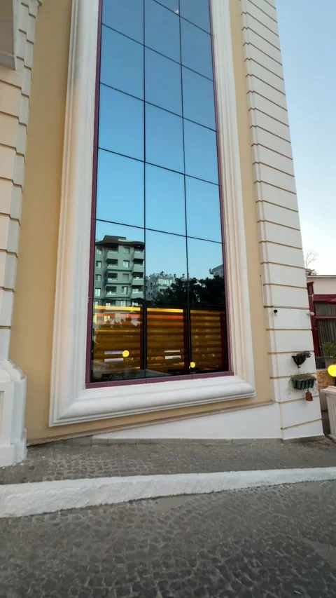 A large stained glass window in a building, with colorful patterns and sunlig Stock Footage 303360487
