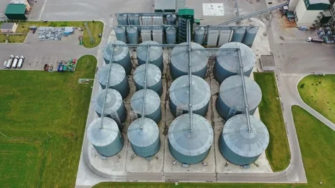 Large steel elevators. Granaries for grain on the field.  Stock Footage 134776168