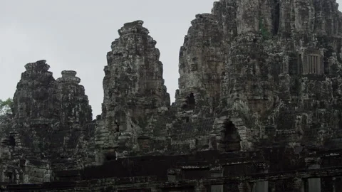 Large Stone Faces On The Towers At The Bayon Temple. Cambodia Vídeo Stock 134586860