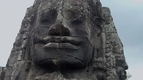 Large Stone Faces On The Towers At The Bayon Temple. Cambodia Vídeos de archivo 134614767