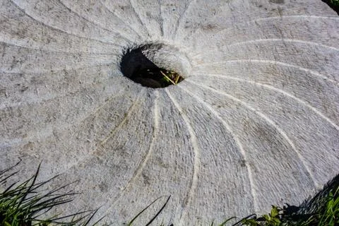 Large stone millstone from the mill Stock Photos