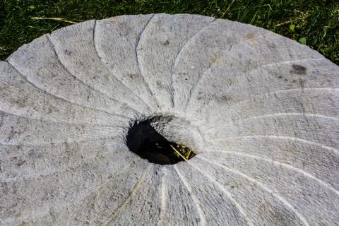 Large stone millstone from the mill Stock Photos