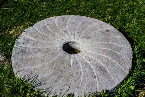 Large stone millstone from the mill Stock Photos