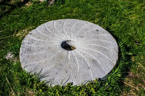 Large stone millstone from the mill Stock Photos