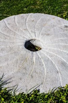 Large stone millstone from the mill Stock Photos
