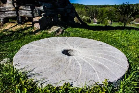 Large stone millstone from the mill Stock Photos