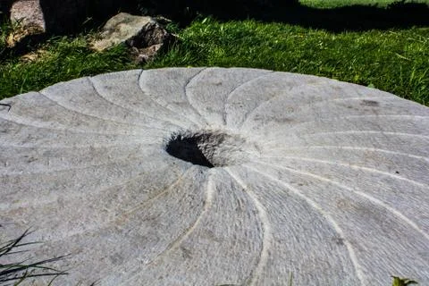 Large stone millstone from the mill Stock Photos