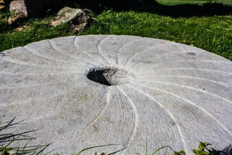 Large stone millstone from the mill Stock Photos