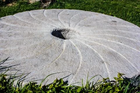Large stone millstone from the mill Stock Photos