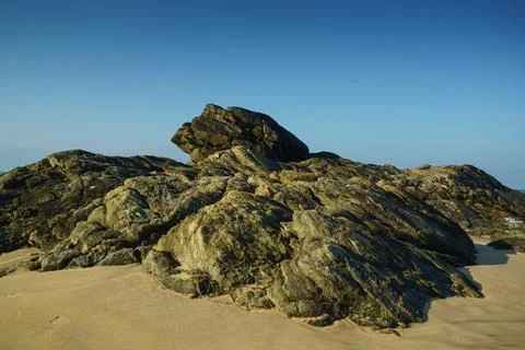 Large stone on the sand on the beach Stock Photos