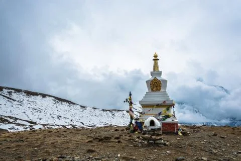 A large stone stupa on the background of the cloudy sky, Nepal. Stock Photos