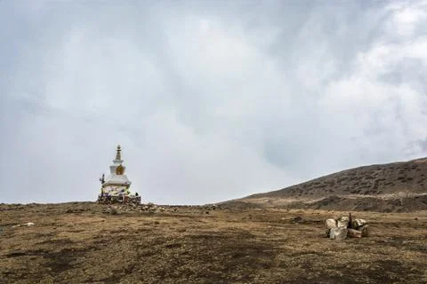 A large stone stupa on the background of the cloudy sky, Nepal. Stock Photos